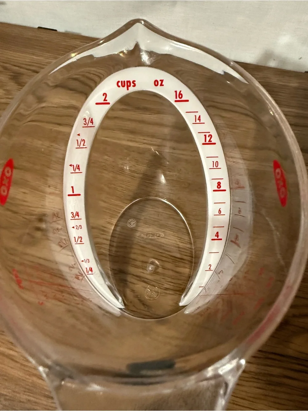 Oxo Clear Plastic Measuring Cup with Black Handle and Red Markings